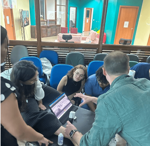 Medical students in a classroom setting, focusing on a lecture about the fundamentals of ultrasound diagnostics.