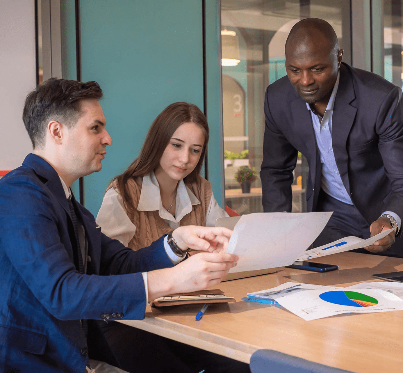 A team of people working together to review finances and donation options