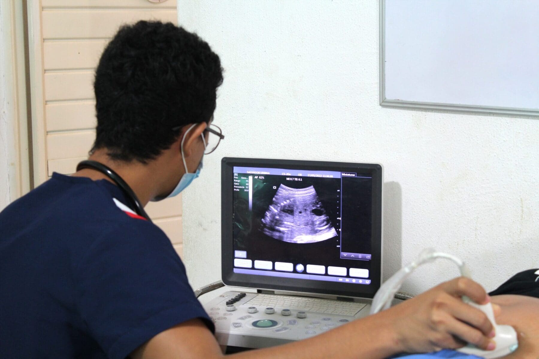 Student Practicing Ultrasound in safe clinical setting on a volunteer